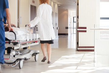 Hospital staff rushing patient to hospital room