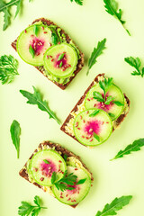 Toasts with watemelon radish, avocado and flex seeds
