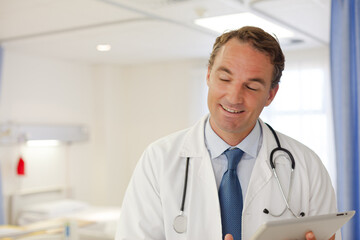 Doctor smiling in hospital room