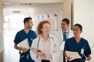 Hospital staff talking in hallway