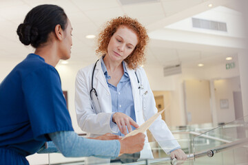 Doctor and nurse talking in hospital