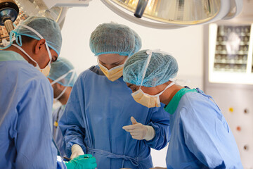 Surgeons working in operating room