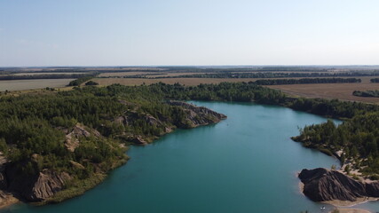 Fototapeta na wymiar Hills and blue water. Romantsev mountains. The conductors of Tula, a photo from a drone