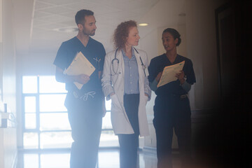 Fototapeta premium Hospital staff walking in hallway