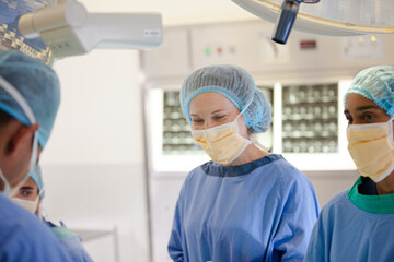 Surgeons working in operating room