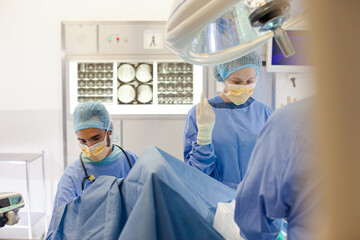 Surgeons working in operating room