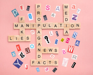 Crossword puzzle about manipulation and propaganda in the media, top view