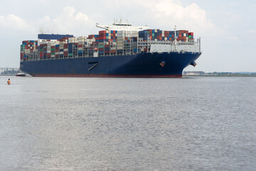 cargo container ship sailing on the river