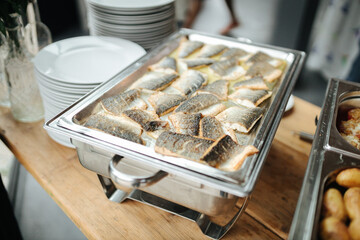 Tray of delicious fish at a buffet