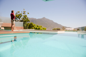 Man standing at poolside