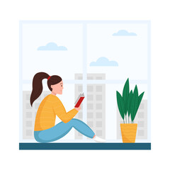 Fototapeta premium Young woman reading book on the windowsill