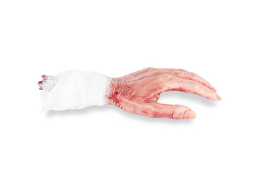 Realistic artificial cutted off bloody dead human hand with bandage, isolated on white background