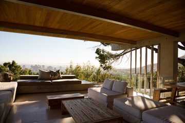 Fototapeta na wymiar Sofas and coffee table on modern balcony