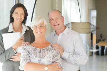 Financial advisor posing with clients