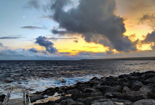 Sunset on the rocky beach of Ireland.