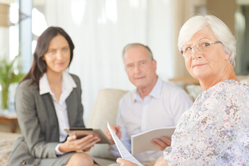 Fototapeta premium Financial advisor using tablet computer with clients