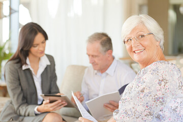 Fototapeta premium Financial advisor using tablet computer with clients