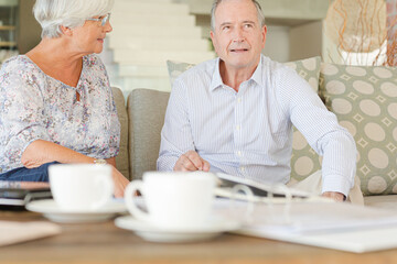 Couple relaxing on sofa together