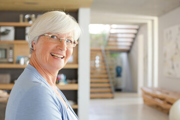 Older woman posing in modern house