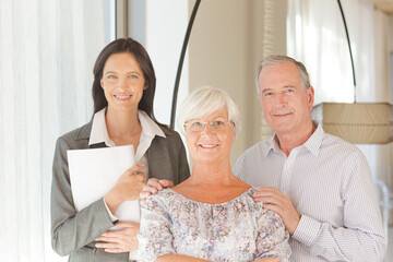 Financial advisor posing with clients