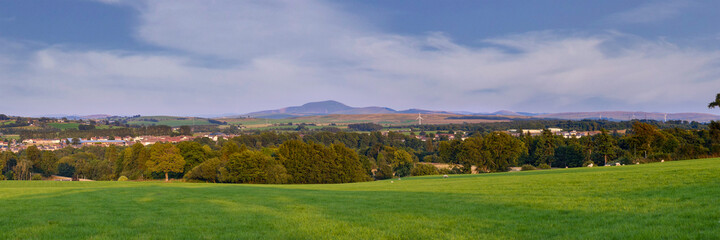 Fototapeta na wymiar Panoramic view of the green Scottish countryside with Tinto Hill at the far distance