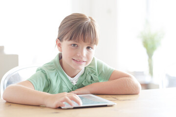 Fototapeta na wymiar Girl with tablet computer, smiling