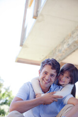 Father and daughter hugging outdoors