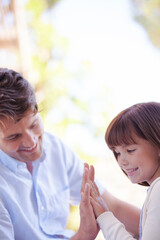 Father and daughter playing outdoors