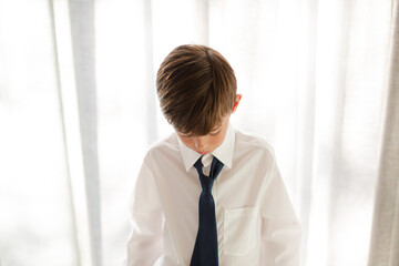 Boy  wearing shirt and tie, smiling