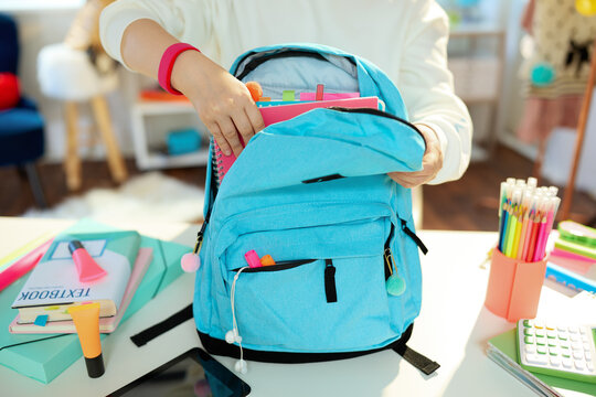 Closeup On Child Packing For School At Home In Sunny Day