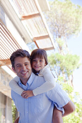 Father and daughter hugging outdoors