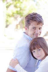 Fototapeta premium Father and daughter hugging outdoors