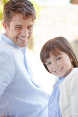 Fototapeta premium Father and daughter smiling outdoors