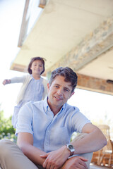 Father and daughter outdoors, smiling