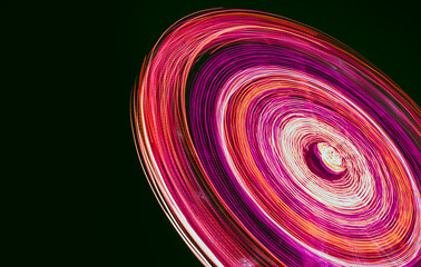 Amusement park carousel neon lights.Long exposure pink light spinning attraction. Pink and purple long exposure Ferris wheel lights.