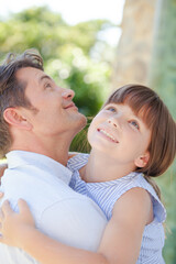 Fototapeta premium Father and daughter hugging outdoors