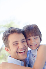 Fototapeta premium Father and daughter hugging outdoors