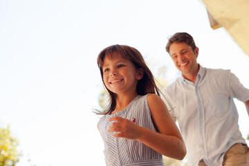 Father and daughter playing outdoors