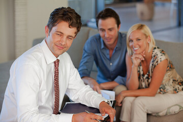 Financial advisor smiling with clients