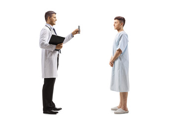 Doctor showing a mobile phone to a young male patient
