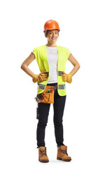 Full length portrait of a young female construction worker wearing a hardhat and a tool belt