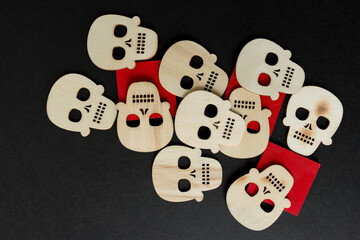 halloween theme with wooden shapes arranged on a black paper background