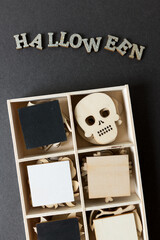halloween themed wooden shapes in a box close up