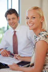 Financial advisor talking to client on sofa