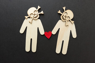 wooden silhouettes with laser cut-scary monster masks and skull and bones on a dark background