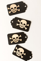 laser cut wooden scary monster faces, skull and bones, and ghosts on black chalk tags on white