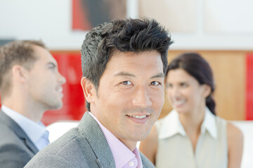 Businessman smiling in meeting