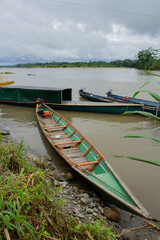 colorful boat on the river with trees in the background