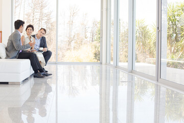 Business people talking on sofa in office