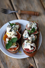 Delicious toast with gorgonzola cheese and figs. Healthy snack. Keto toast.